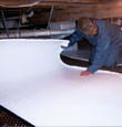 Port Matilda insulation being installed in a crawl space.