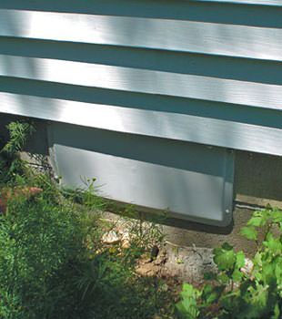 A gray crawl space vent cover in Curwensville