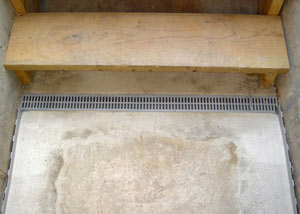 Our grated drain system installed on a leaking basement staircase in Julian.