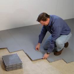 basement subfloor tiles being installed by a contractor in Bellwood