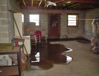 a flooded basement floor in a Cherry Tree home