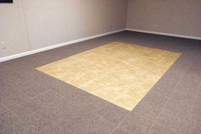 tiled and carpeted basement flooring installed in a Du Bois home