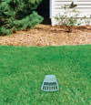 A buried gutter drain downspout extension installed in a Cherry Tree home