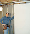 Installing wall panels on top of our basement wall insulation in Port Matilda